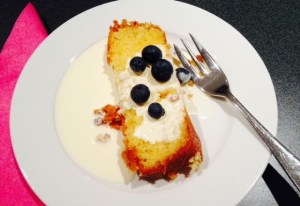 Emma likes her cake with lots of cream and blueberries